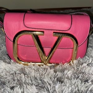 Pink and gold Valentino crossbody bag.